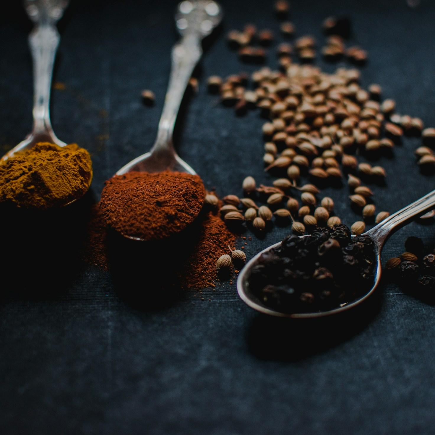 Members collaborating in a modern kitchen space, sharing recipes and cooking techniques